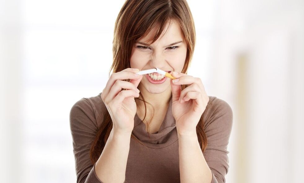 Girl breaks a cigarette and stops smoking photo 2